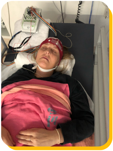 A woman lying on a hospital bed